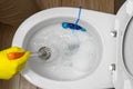 Man cleaning overflowing broken toilet. clogged toilet. Royalty Free Stock Photo