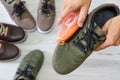 Man cleaning and polishing leather shoes with brush Royalty Free Stock Photo