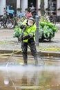 Man cleaning with pressure washer Orebro Sweden august 9 2023
