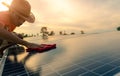 Man cleaning solar panel on roof. Solar panel or photovoltaic module maintenance. Sustainable resource and renewable energy for go Royalty Free Stock Photo