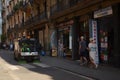 A man cleaning street with the mobile cleaning car .