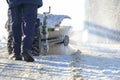 Man cleaning the street from snow manual tractor special Royalty Free Stock Photo