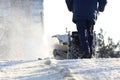 Man cleaning the street from snow manual tractor special Royalty Free Stock Photo