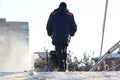 Man cleaning the street from snow manual tractor special Royalty Free Stock Photo