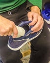 Man Cleaning or Stuffing Inside of Sneaker Royalty Free Stock Photo