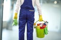 Man with cleaning supplies in building Royalty Free Stock Photo