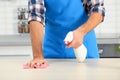 Man cleaning table with rag in kitchen Royalty Free Stock Photo