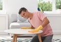 Man cleaning table with rag Royalty Free Stock Photo