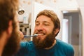 Man cleaning teeth in bathroom