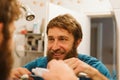 Man cleaning teeth in bathroom