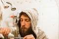 Man cleaning teeth in bathroom