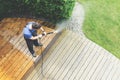 Cleaning terrace with a power washer - high water pressure clean Royalty Free Stock Photo