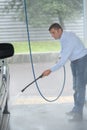 man cleaning tire care with water pressure