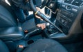 Man cleaning, vacuuming interior of the car by vacuum cleaner, transport concept Royalty Free Stock Photo