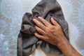 Man cleaning wall with a gray cloth and Disinfectant to kill germs, viruses and bacteria Royalty Free Stock Photo