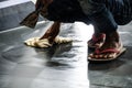 Man cleaning wet floor at construction site Royalty Free Stock Photo