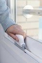 man cleaning a white aluminum sliding window Royalty Free Stock Photo
