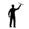 Man cleaning window. Black silhouette of cleaner. Worker tidy glass. Isolate scene of homework Royalty Free Stock Photo