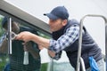 man cleaning window in office Royalty Free Stock Photo