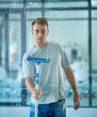 Man, cleaning and window in office building as janitor with squeegee tool for hygiene service, glass or bacteria. Male Royalty Free Stock Photo