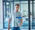 Man, cleaning and window in office building or service with squeegee tool for hygiene, glass or bacteria. Male person Royalty Free Stock Photo