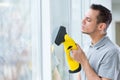 man cleaning window with vapor Royalty Free Stock Photo