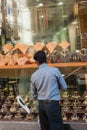 Man cleans glass showcases jewelry store in Dubai