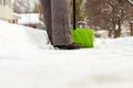 A man cleans snow from sidewalks with snowblower. Royalty Free Stock Photo