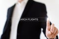 man clicks on the search icon in the line that says search flights. Royalty Free Stock Photo