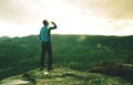 Man on a cliff edge on top of mountain with gorgeous view Royalty Free Stock Photo