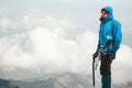 Man climber with ice axe standing on mountain Royalty Free Stock Photo