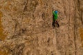 Man Climber Rock Climbing. Cliffs in Tamgaly Tas, Kazakhstan. Aerial View