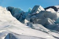 Man climbing the blue ice of the Skaftafellsjokull glacier, winter Iceland