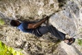 Man climbing a boulder Royalty Free Stock Photo