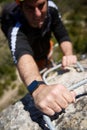 A man climbing a ferrata route in Calcena, Spanish mountains