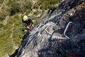 A man climbing a ferrata route in Calcena, Spanish mountains