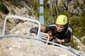 A man climbing a ferrata route in Calcena, Spanish mountains