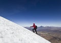 Man climbing on glacier of Sajama Volcano in Bolivia