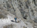 Man climbing with his dog