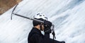 Man is climbing with ice ax on the glacier. Royalty Free Stock Photo