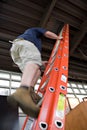 Man Climbing a Ladder Royalty Free Stock Photo