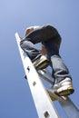 Man climbing ladder Royalty Free Stock Photo