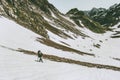 Man climbing in mountains Travel survival lifestyle