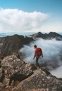 Man climbing in mountains traveling alone in Norway hiking adventure outdoor