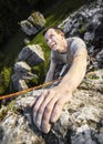 Man climbing natural rocky wall.