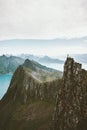 Man climbing in Norway traveler standing on cliff Royalty Free Stock Photo