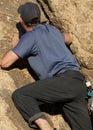 Man climbing a rock Royalty Free Stock Photo