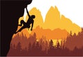 Man climbing rock overhang. Mountains and forest in the background. Silhouette of climber with brown, orange and yellow background Royalty Free Stock Photo
