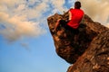 Man climbing on rock. Young fit, strong male climber