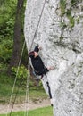 Man climbing rocky wall.